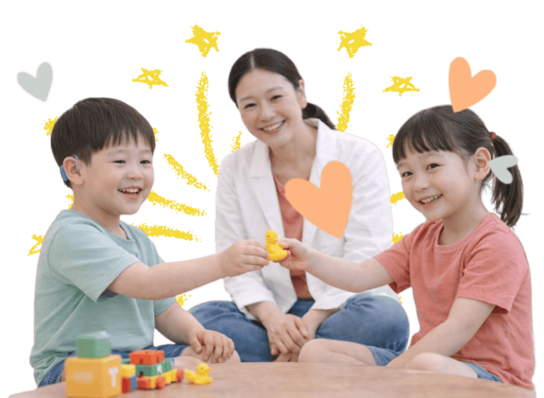 Children practicing social skills with therapist using toys and play activities.