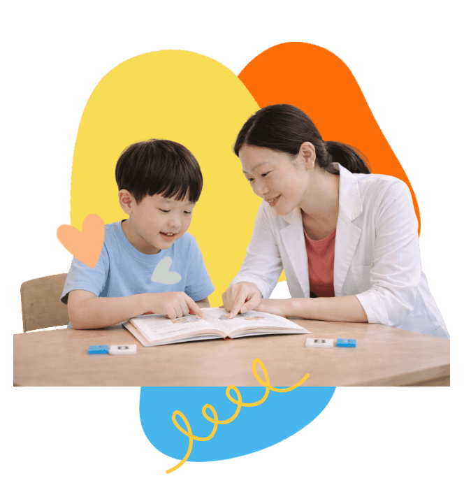 Child receiving speech therapy for reading support from a speech therapist.