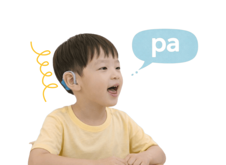Young boy wearing hearing aids practicing speech therapy exercises.