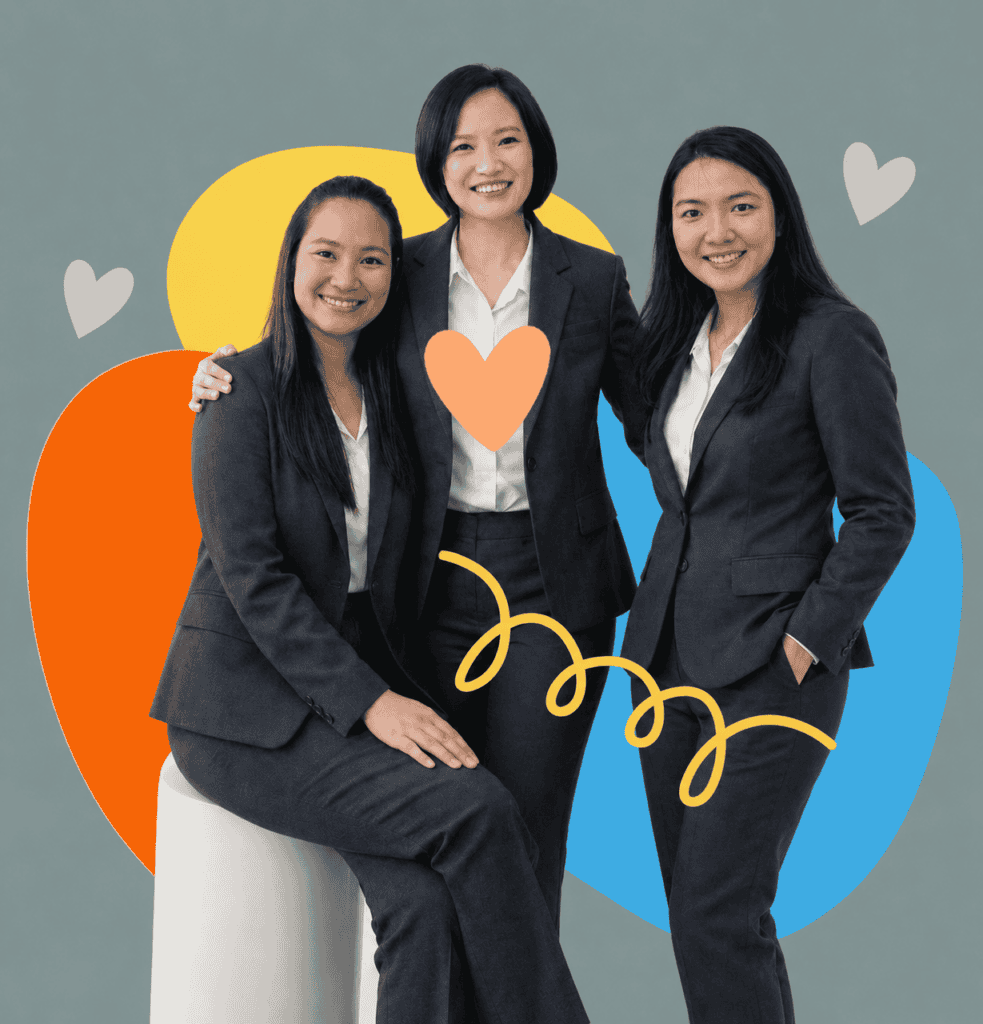 Speech therapy team members in professional suits smiling for the camera.